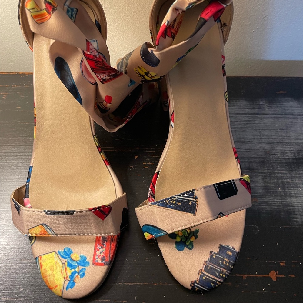 Wrap around satin heels. Only worn once. Good condition.